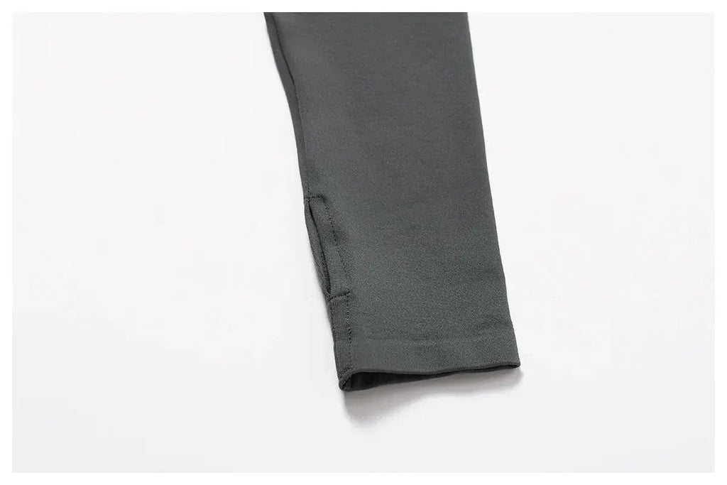 A close-up of the lower sleeve of the Mirèlle Workout Jacket with Zip & Quick Dry in dark gray, displayed on a white background. The sweat-wicking, slightly stretchy fabric has visible stitching along the edges.